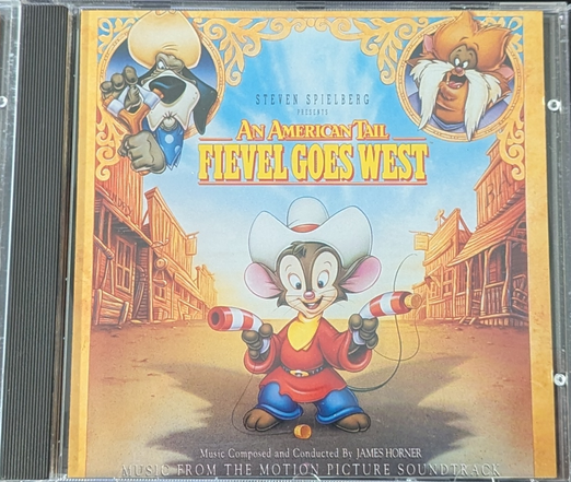 Cover Description
An American Tail - Fievel Goes West
The title reads: Steven Spielberg presents An American Tail Fievel Goes West. Music composed and conducted by James Horner, Music from the motion picture soundtrack.

The cover features Fievel in its center, wearing a white cowboy hat, his usual red longsleeve and blue pants attire, as well as a yellow scarf. He holds two toy guns, one in each paw, striped red and white like candy canes. One of them has a cork in its barrel, another one lying on the ground, each connected to the guns with a string, indicating the guns shoot the corks.
In the top left of the cover is Wylie Burp, an old Great Dane dog  with a cowboy head and a blue scarf, aiming his loaded slingshot.
In the top right corner is the face of "Tiger", an orange, fluffy, chubby cat. He has a friendly smile and a mustache-like brighter beard.

The background is a typical "Wild West" city with wooden houses on both sides, one of them a bank.

Fievel is covered by a big, fluffy shadow that could be the head of a cat.