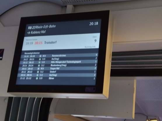 Photo of a train display showing 16 minutes delay where the clock shows that it's actually 19.