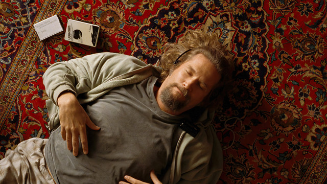 Jeff Bridges lying on his beloved rug, walkman headphones on, eyes closed. From 