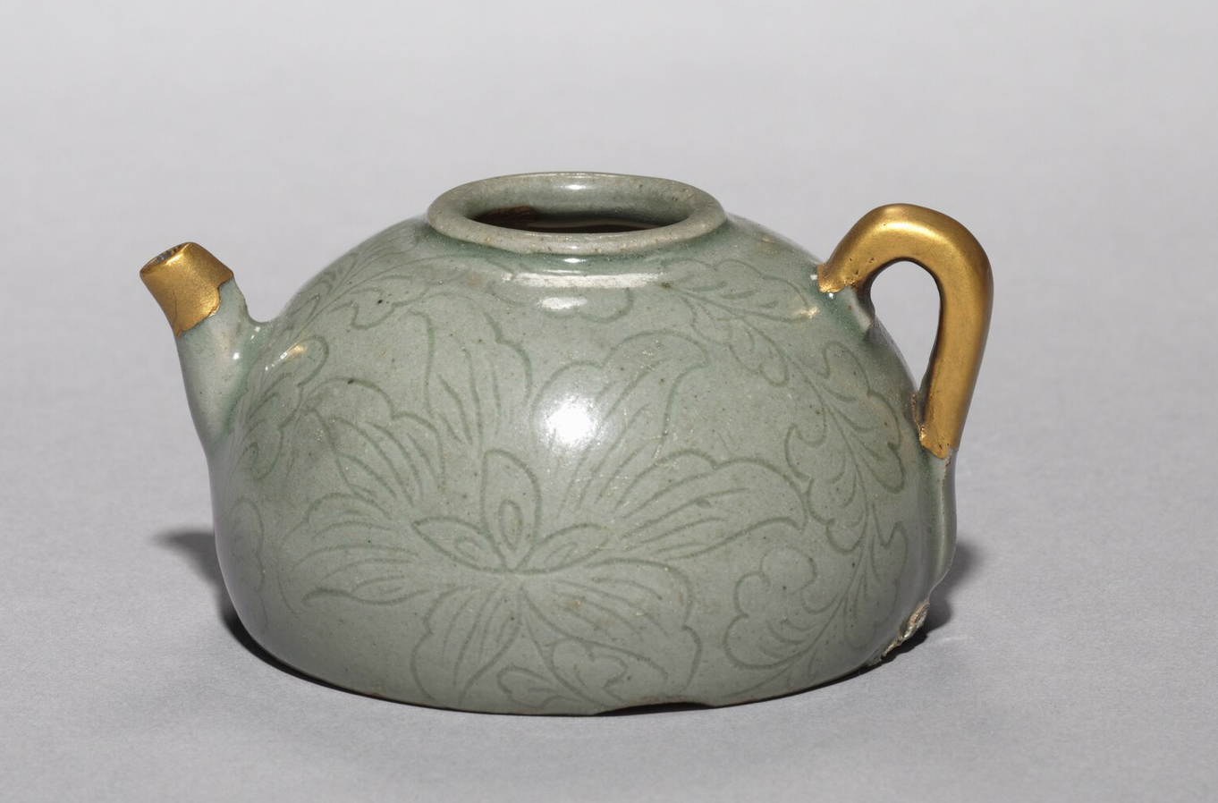greenish celadon ceramic pot with fixed pieces in gold